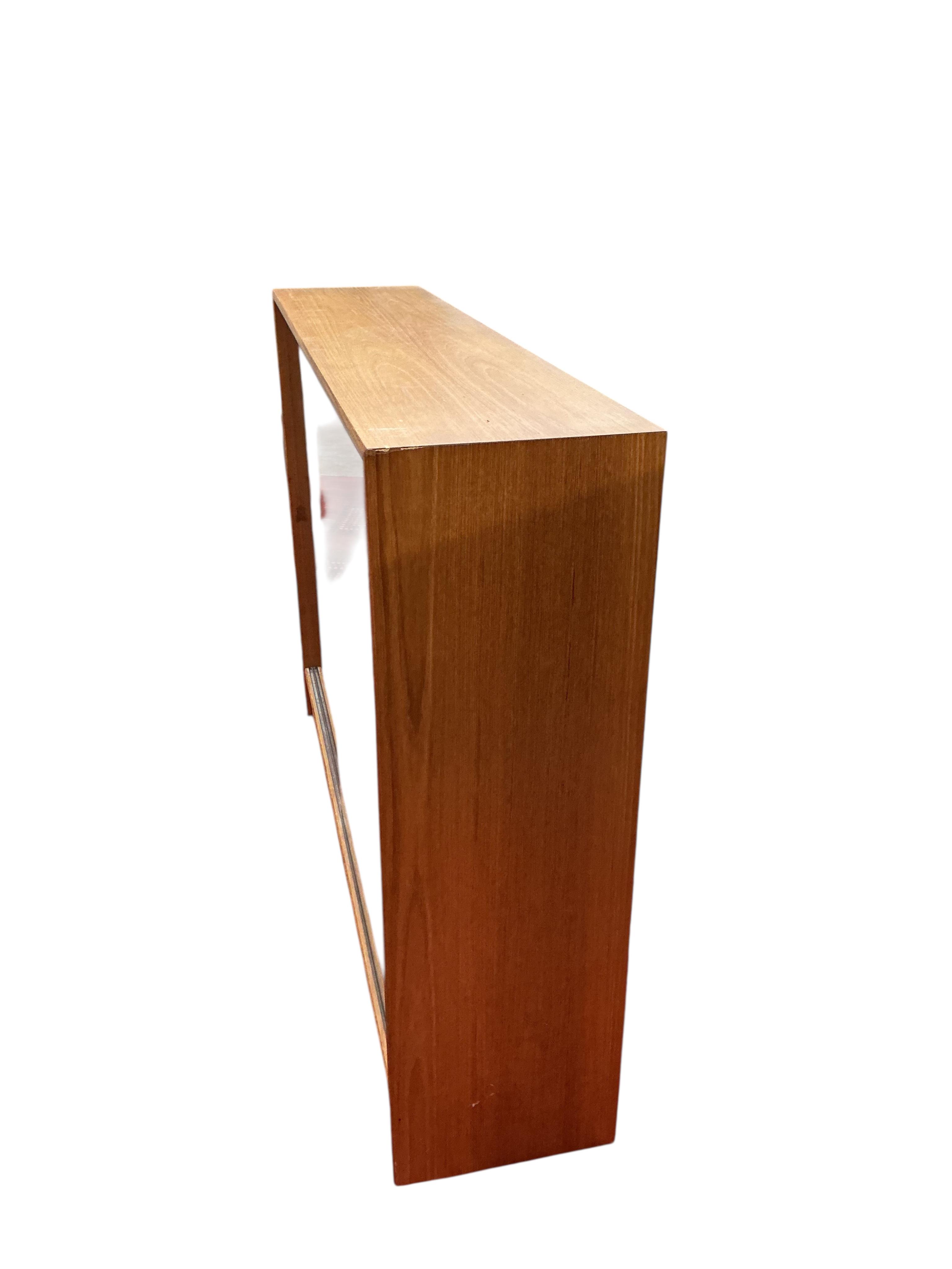 A mid century glazed teak bookcase, width 122cm, depth 28cm, height 90cm